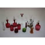 A collection of glassware including a four vase epergne, three cranberry glass decanters and eight
