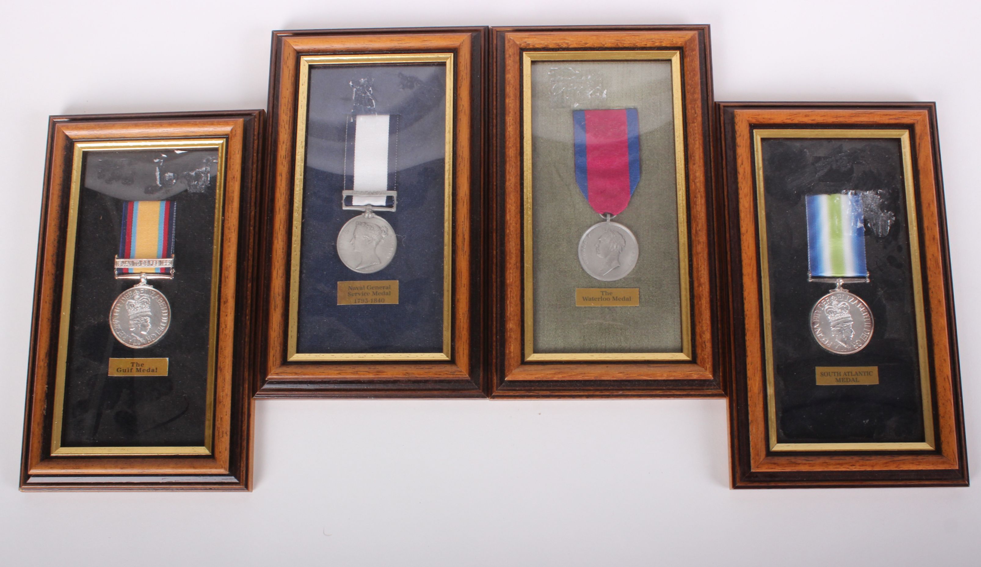 Four mounted and framed reproduction medals: Waterloo, Naval General Service (1793) South