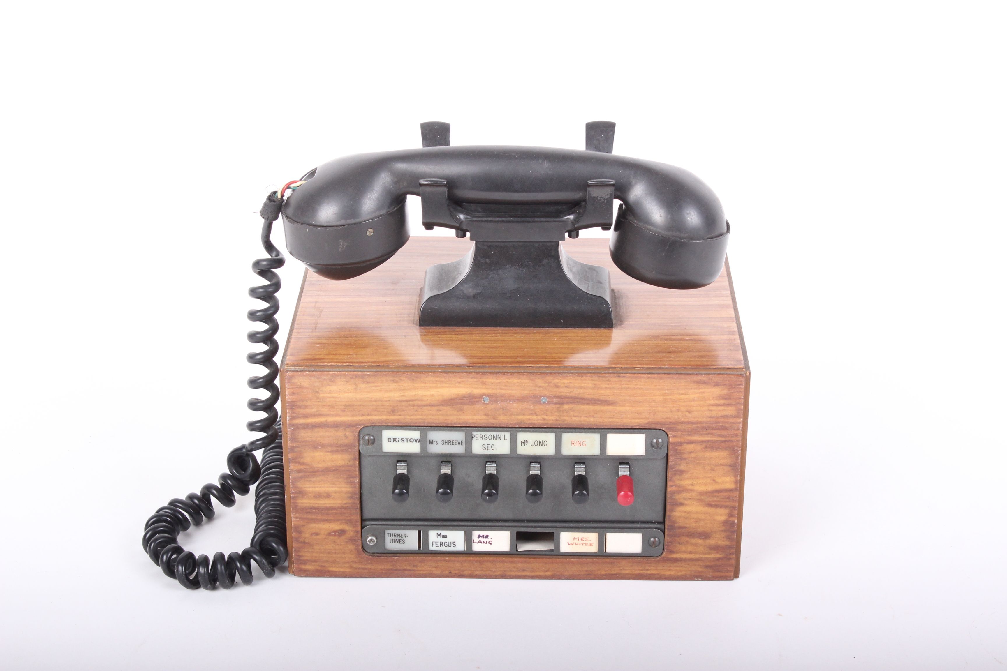 Telephone: a Dictograph Bakelite hand set on a box base with office extension indicates, No makers