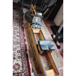 Exercise Machine: a wooden framed 'Water Rower' with Waterflow Series IV Performance monitor,