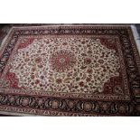 A Kashan carpet, beige ground 280 x 200cm