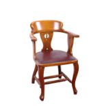 An Edwardian yoke back armchair, walnut framed and a hardwood half round two tier side table, 83cm