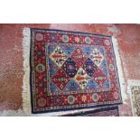 Three hand woven rugs including a picture rug