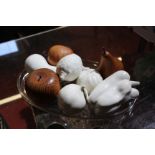 Three items of treen 'fruit' and five items models of fruit in ceramic on an oval glass tray