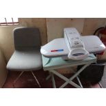 A Fastpress power steam flat iron/press, a folding table and a swivel chair