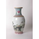 A Chinese Famille Rose vase, painted with a mountainous landscape and calligraphy, colourful