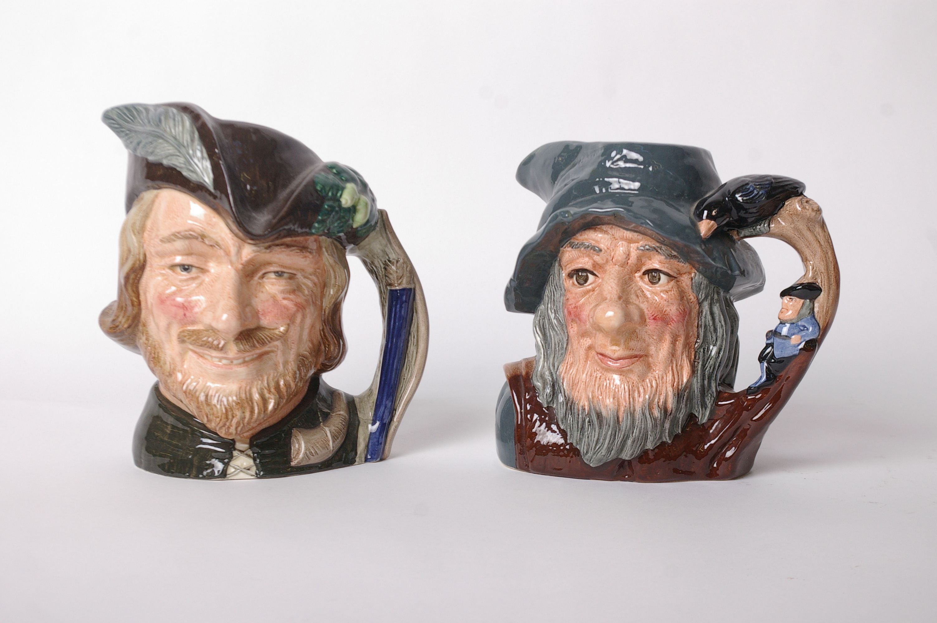 Two large Royal Doulton character jugs: Robin Hood D6527 and Rip Van Winkle D6438