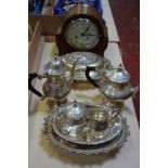 A small quantity of plated items and an oak mantel clock