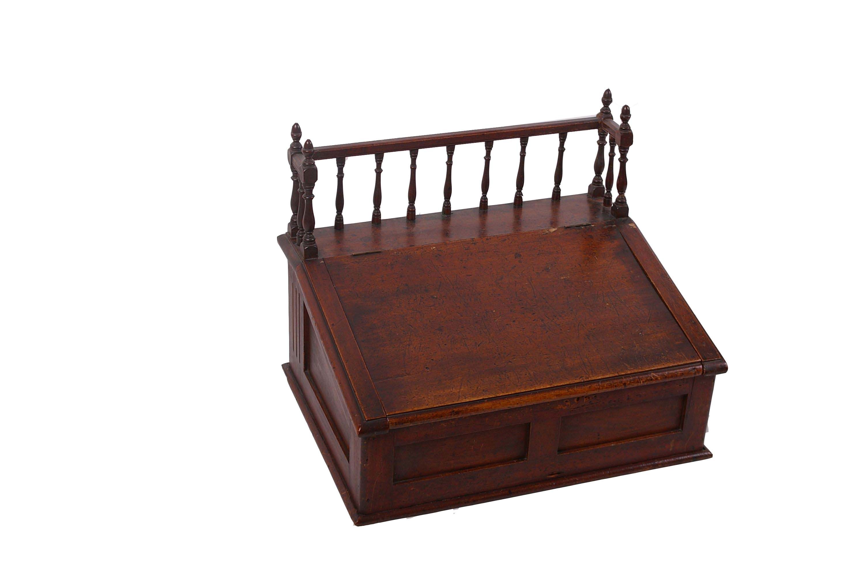 A 19th Century mahogany table top desk with gallery and sloping fall