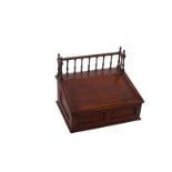 A 19th Century mahogany table top desk with gallery and sloping fall