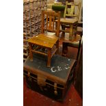 A Victorian leather bound arch top trunk (62cm wide), two children's chairs both early 20th