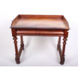 A Victorian mahogany dressing/writing table with short upstand and two drawers, 97cm wide