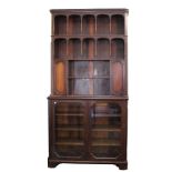 An unusual PAIR of George III style mahogany two section bookcases with fluted canted corners and
