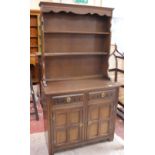 A Welsh style two part dresser 178cm high, 98cm wide together with a low armchair (2)