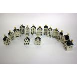 A collection of Bols Gin Dutch ceramic houses made for KLM, nearly complete run 01 to 97 (missing 32