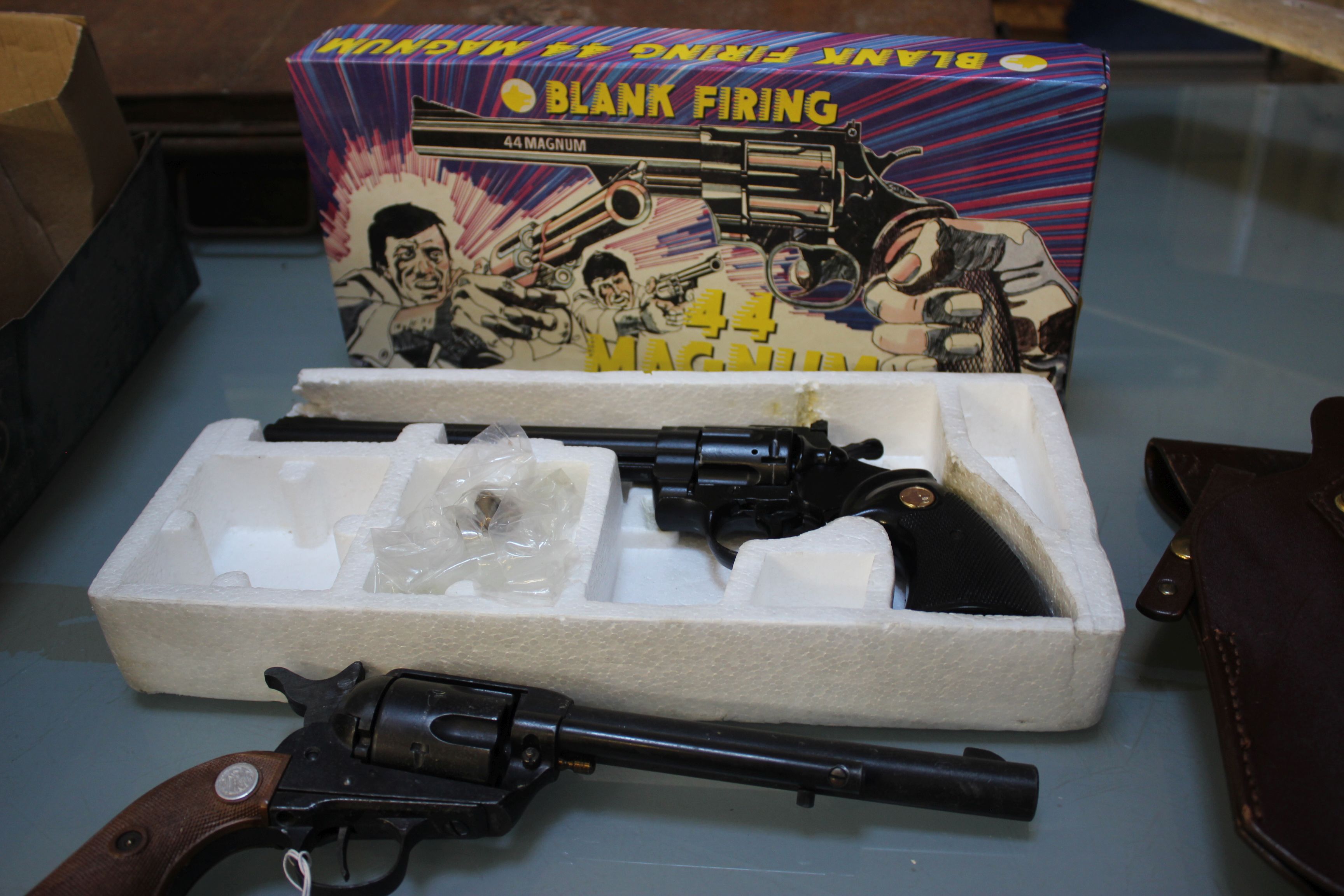 Toy guns: a blank firing 44 Magnum, boxed and another with leather holster