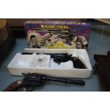 Toy guns: a blank firing 44 Magnum, boxed and another with leather holster