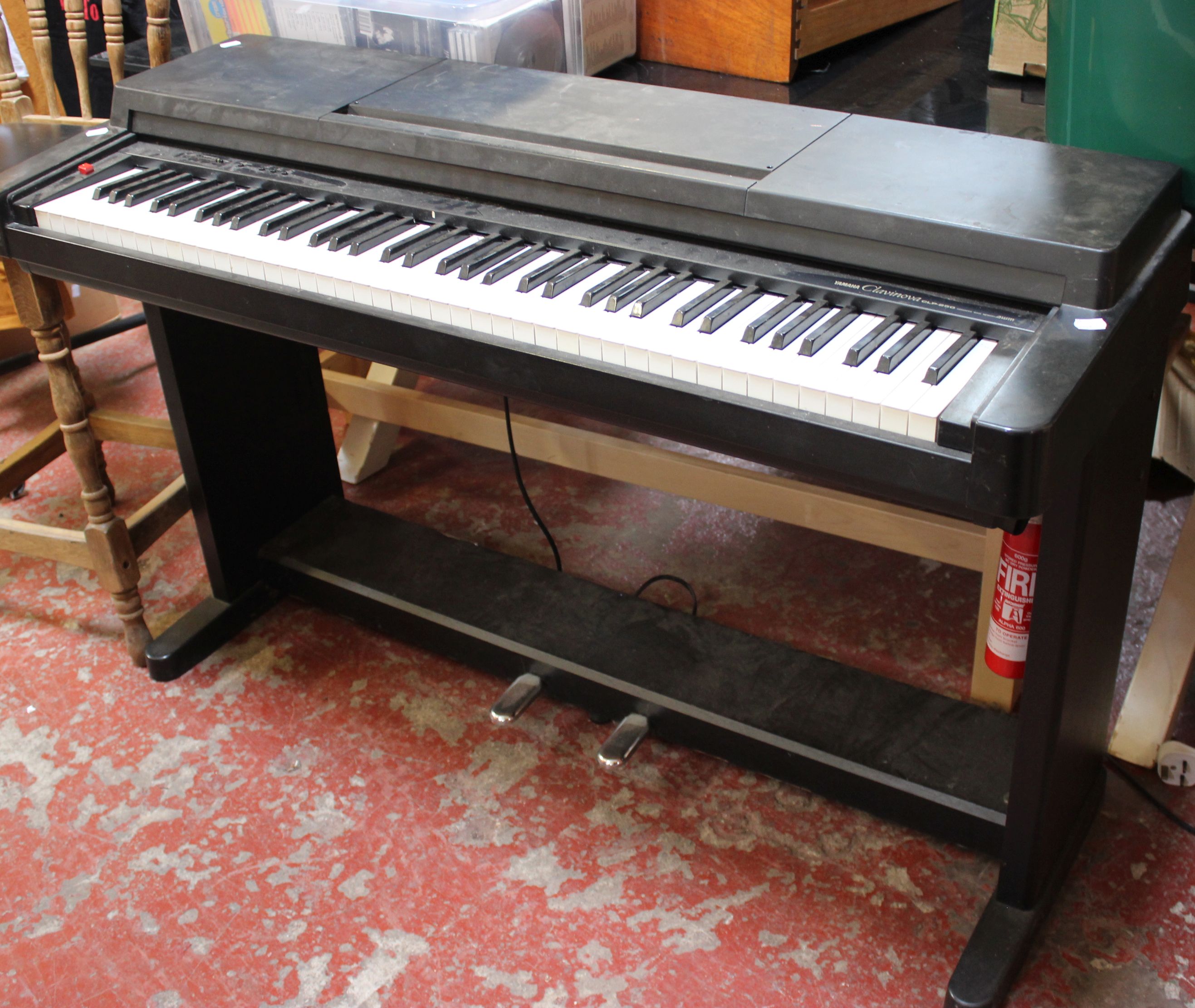 A Yamaha Clavinova CLP-250 electronic piano, in need of attention Provenance: from the estate of