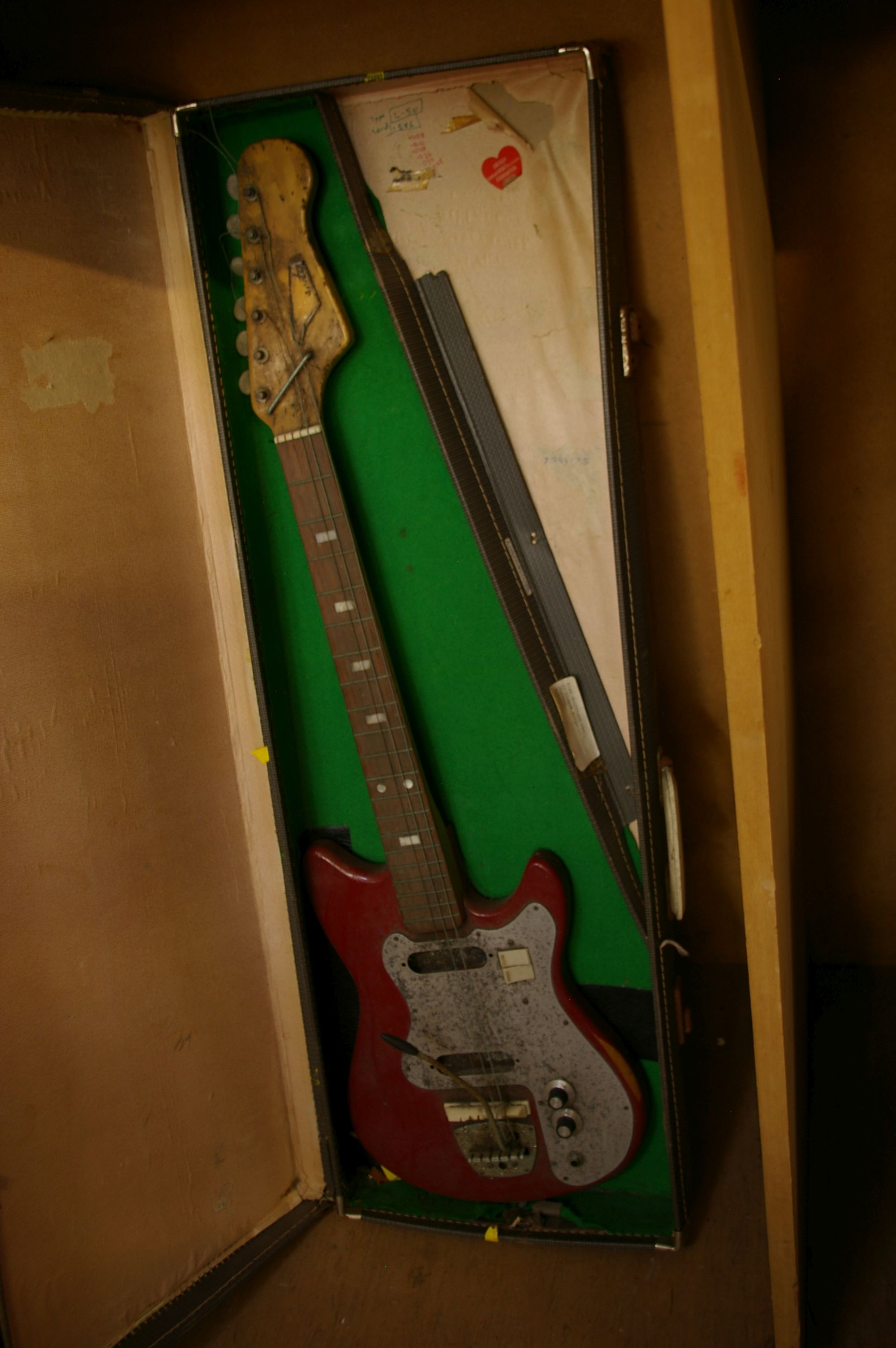 Early 1980's electric guitar in case, with a speaker box used by Bristol band The Escape.Provenance: