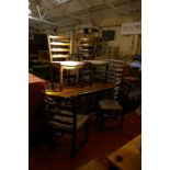 An oak refectory dining table with set of four matching ladder back chairs