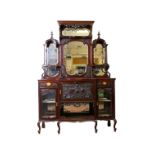 A late Victorian Chippendale revival mahogany mirror back sideboard, well carved with part glazed