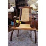 An early 20th Century mahogany and cane folding chair, possibly campaign
