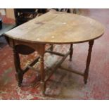 An oak oval top gateleg table with turned legs, 108cm wide
