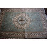 A Kashan carpet, green ground 230 x 160cm