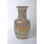 A Japanese vase decorated with rural scenes and a mottle glaze, marked to the base 34cm high