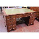 A reproduction mahogany twin pedestal desk with leather inset top, 153cm wide, 90cm depth