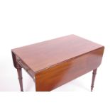 A 19th century mahogany Pembroke table with single drawer and ring turned legs, 19cm wide