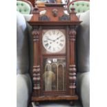 A Victorian style Vienna wall clock with two train movement and mahogany case with top and bottom