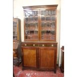 A 19th Century mahogany bookcase with astragal glazed upper section, two drawers and a cupboard