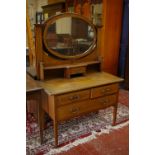 An Edwardian mahogany and crossbanded dressing table 107cm wide and another similar