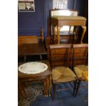 A mixed group to include a mahogany dressing table, pair of rush seated chairs, nest of tables,