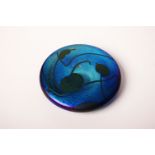 An iridescent Glasform glass paperweight signed DLB