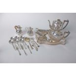 A collection of plated ware to include a pierced gadrooned footed tray, a four piece tea set, a