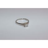 A platinum single stone diamond ring. Single princess cut diamond in a four claw corner setting. 2.