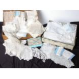 Two boxes of late 19th and early 20th Century white and cream lace, comprising Bedfordshire lace