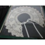 A late 19th Century Maltese collar framed under glass, and a silver dressing table set