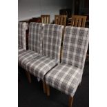 A set of four dining chairs upholstered in grey and white fabric (h: 106cm)