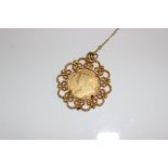 An 1895 Victorian gold sovereign in a 9ct open work bezel mount pendant. 13.9 g