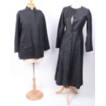 A late 1970s black full length workwear style fitted coat with a Saint Laurent rive gauche Paris