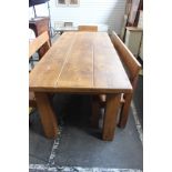 A hardwood dining table 80cm high, 205cm length, 89cm deep and a pair of matching benches