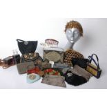 Three early 20th Century mesh evening bags, two glass perfume bottles within a leather case, an