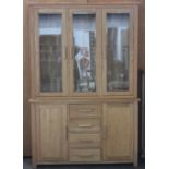 Solid light oak, glazed top cabinet, with four drawers and two cupboards.H: 195cm, w: 131cm, d: