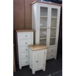 Large glazed, painted wood cupboard, with a chest of drawers and a bedside cupboard.