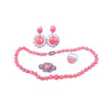 A suite of red coral jewellery to include a coral bead necklace graduating from 7mm to 11mm beads on