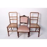 A pair of cane seated chairs and two others together with a mahogany brass inlaid coffee table,