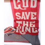 A pair of grey wool WW II blankets (dated 1941 and 1944), an Ensign flag and a large red and white
